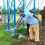 PASTOR DANIEL AND SOLAR TECHNICIAN ENJOYING WATER PASTOR DANIEL AND SOLAR TECHNICIAN ENJOYING WATER scaled
