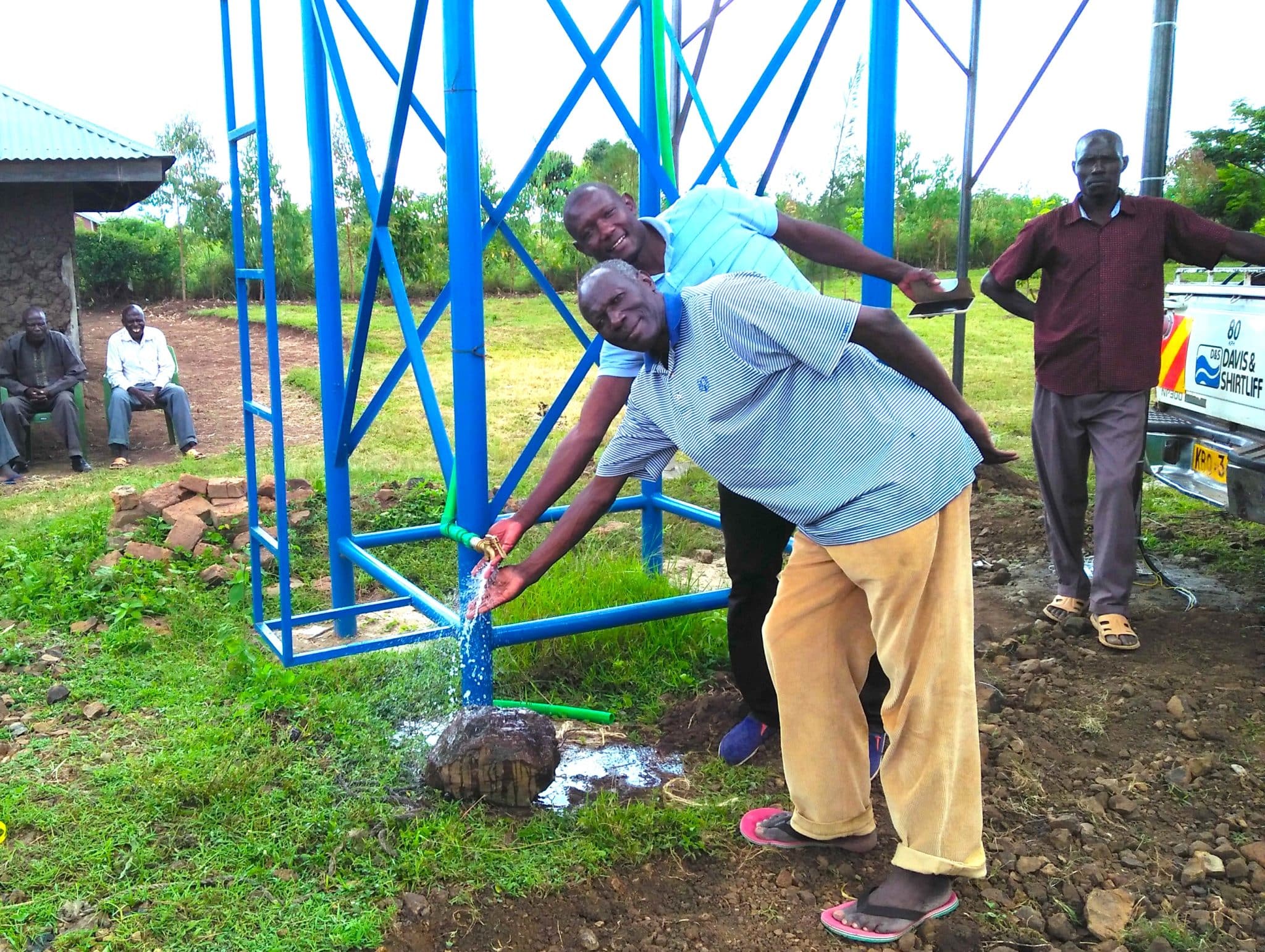 PASTOR DANIEL AND SOLAR TECHNICIAN ENJOYING WATER scaled